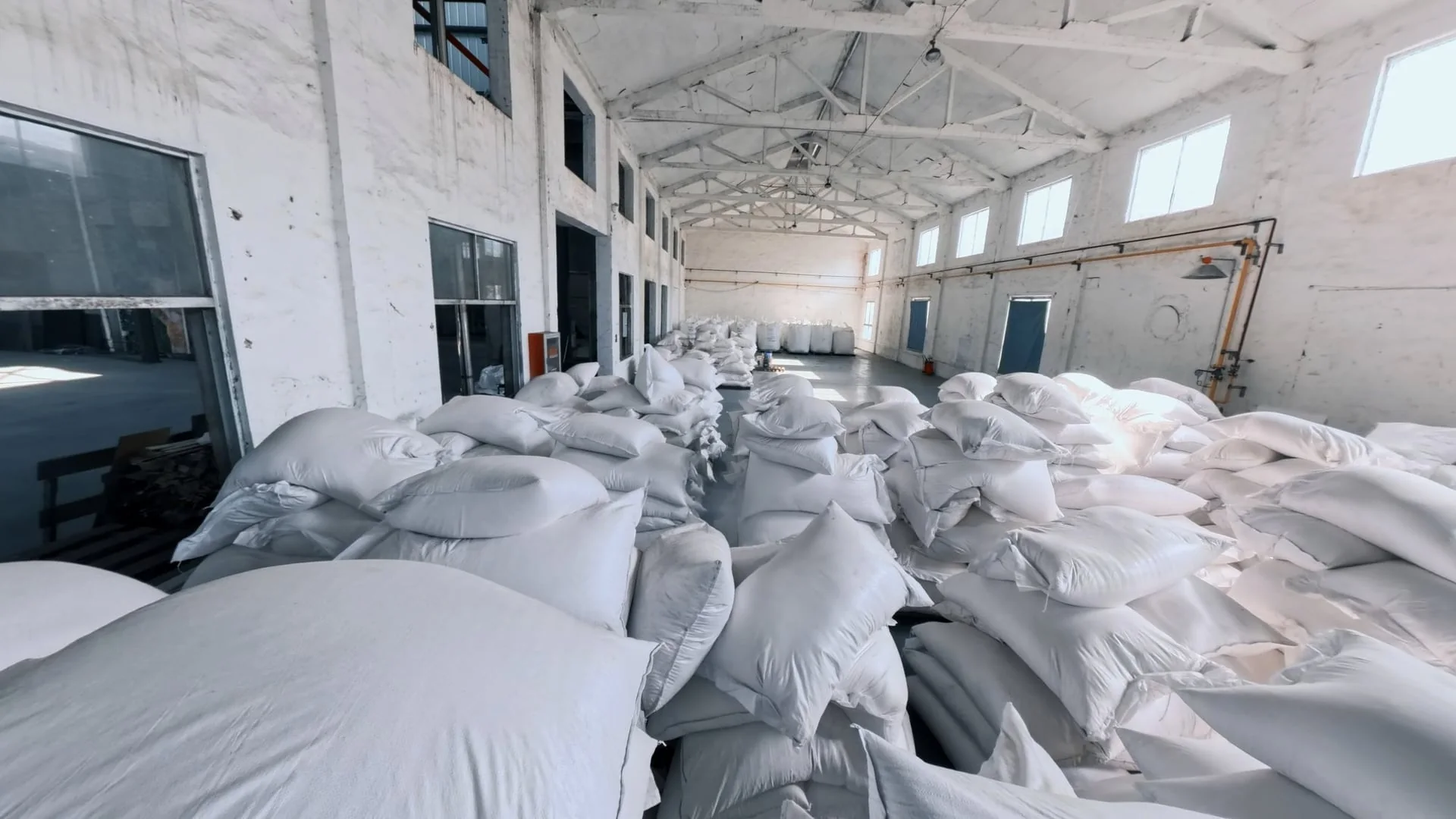 Raw material bags prepared for CleanPaw Island cat litter production